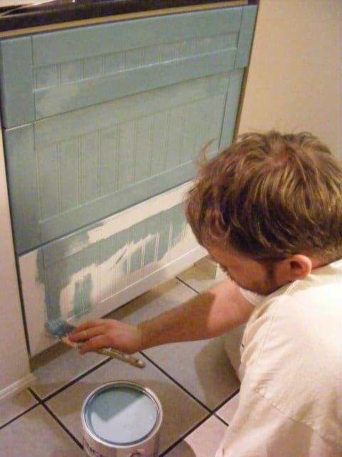 White-Guy-Painting-Kitchen-Cabinet