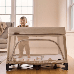 baby-standing-in-pack-and-play-crib