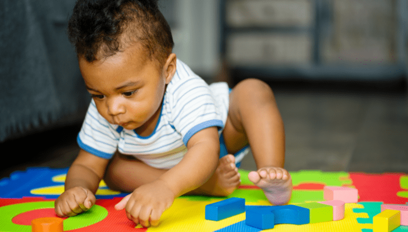 curious-baby-playing-with-toys-on-the-floor