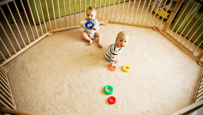 cute-white-babies-playing-in-a-playpen