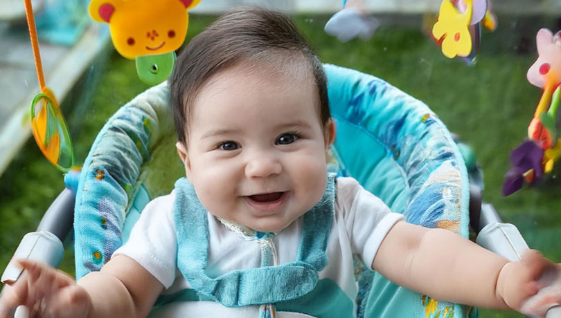 smiling-white-baby-playing