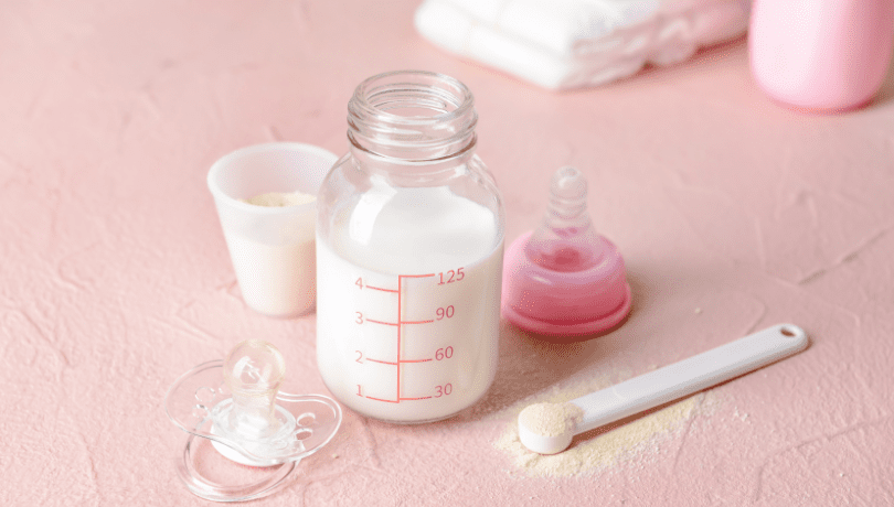 glass-baby-bottle-with-measuring-cup-and-formula