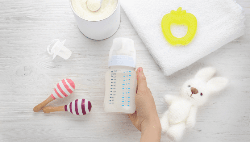 plastic-baby-bottle-with-formula-and-other-accessories