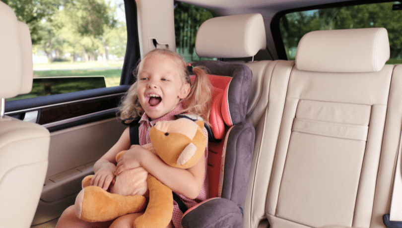 excited-girl-in-her-car-seat