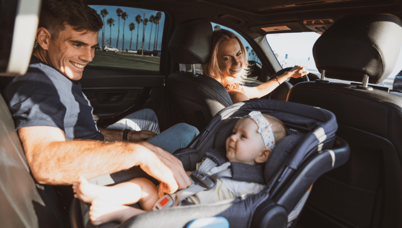 father-mother-and-baby-seated-in-a-car
