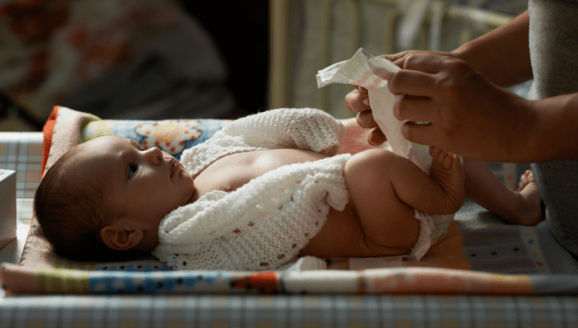 newborn-baby-getting-diaper-changed