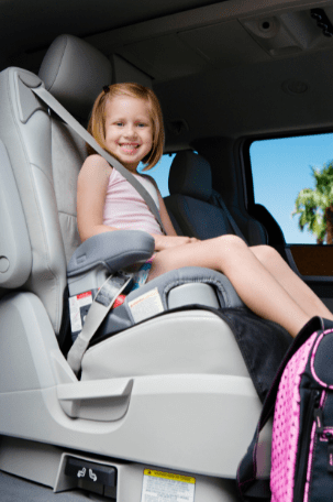 young-girl-sitting-in-a-booster-car-seat