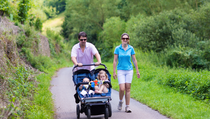 parents-hiking-with-two-kids-in-a-double-stroller