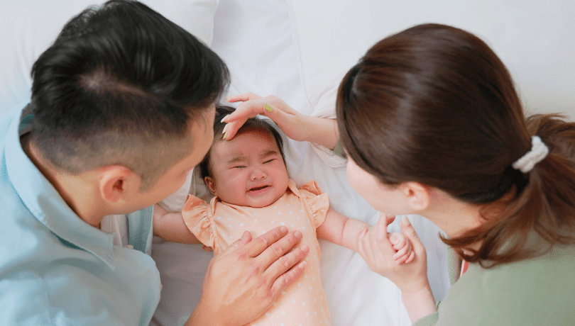 young-asian-parents-trying-to-comfort-their-crying-baby