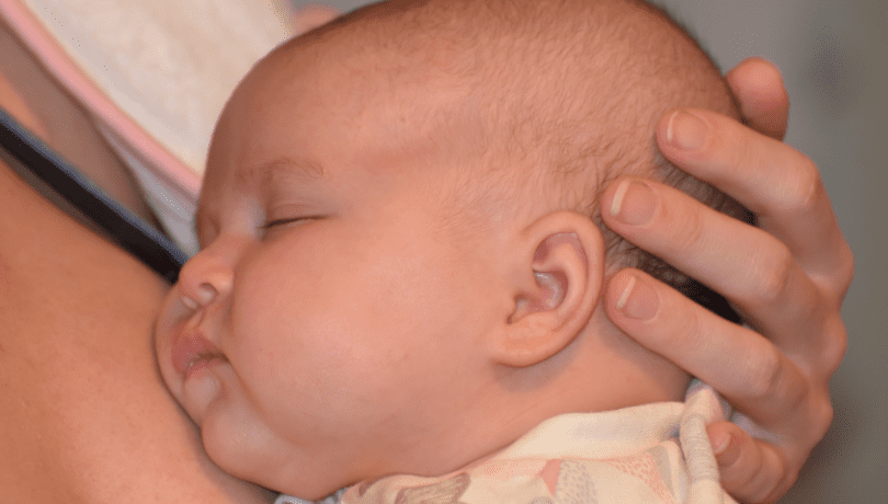 8-week-old-baby-girl-being-cuddled