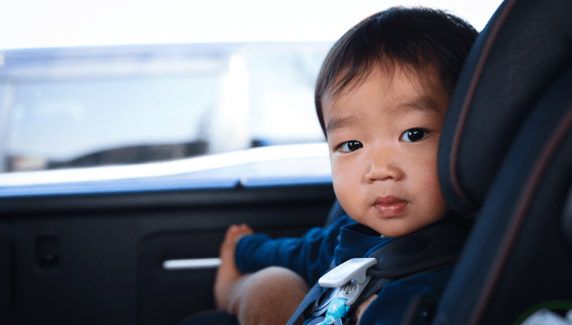 asian-baby-secured-in-his-infant-car-seat