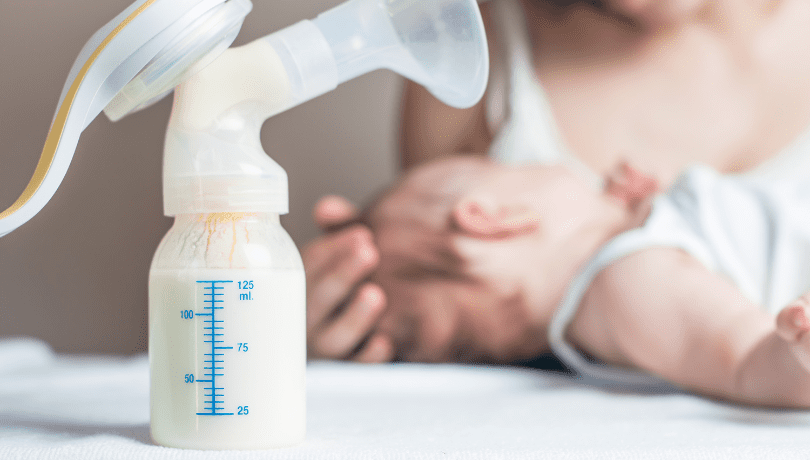 breast-pump-with-baby-bottle-displayed-as-mother-settles-her-baby