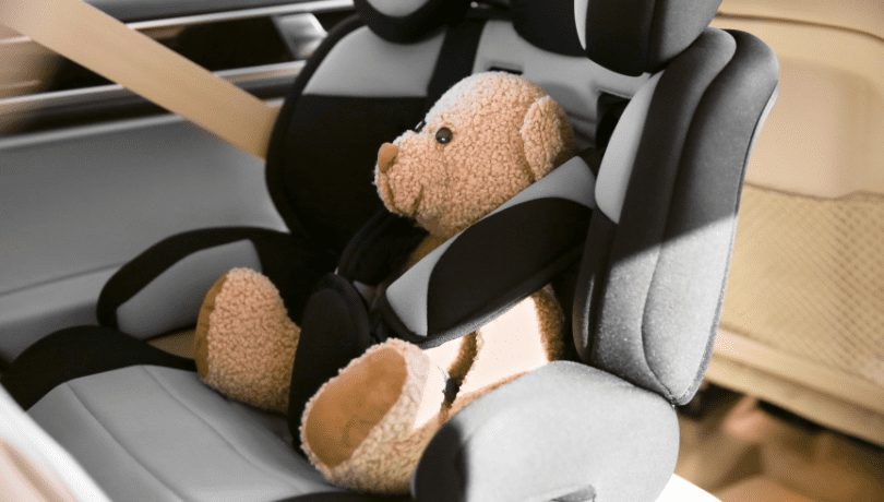 infant-car-seat-with-stuffed-teddy-bear-buckled-in