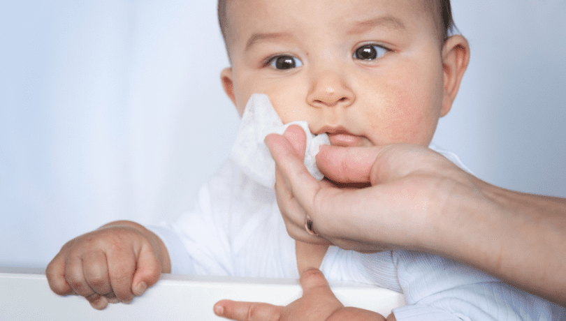 mom-wiping-away-drool-from-babys-mouth