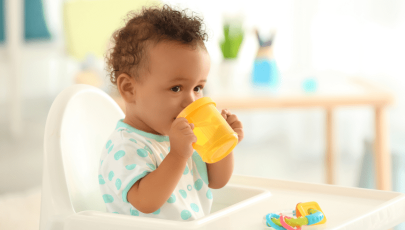 sweet-brown-baby-drinking-from-a-sippy-cup