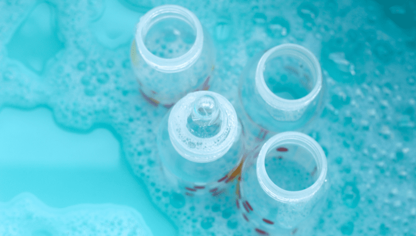 wash-baby-bottles-in-a-blue-basin