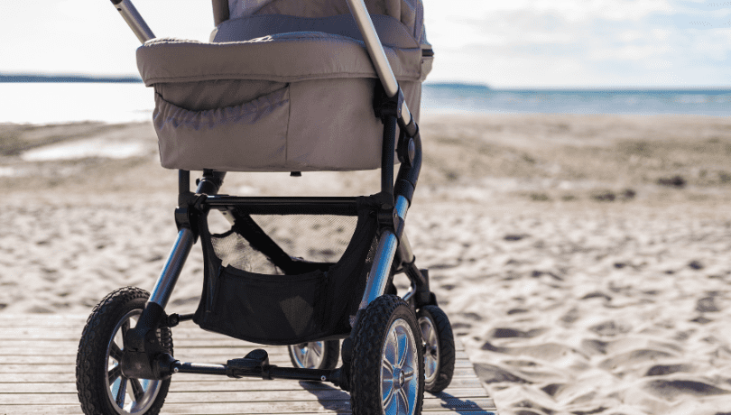 baby-stroller-in-a-beach-on-a-sunny-day