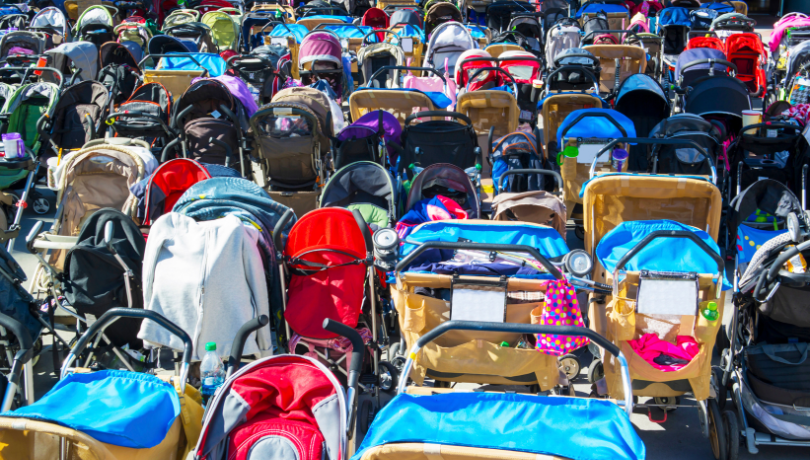many-colorful-baby-strollers-parked