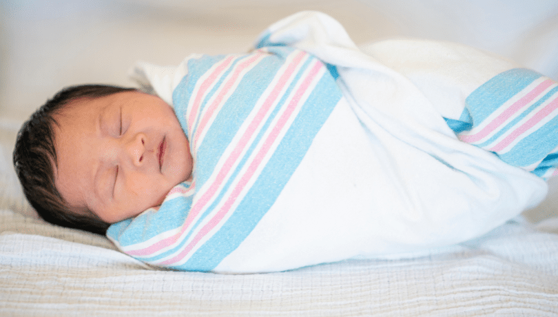 sleeping-newborn-baby-boy-wrapped-in-a-swaddle