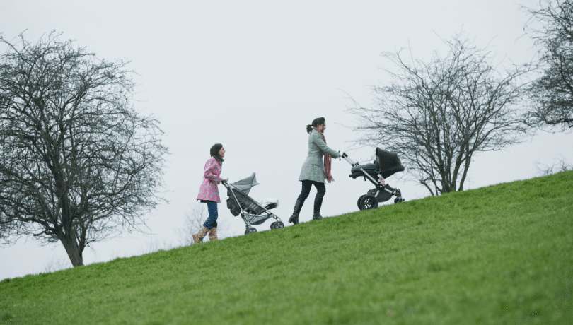 two-mothers-pushing-stroller-uphill