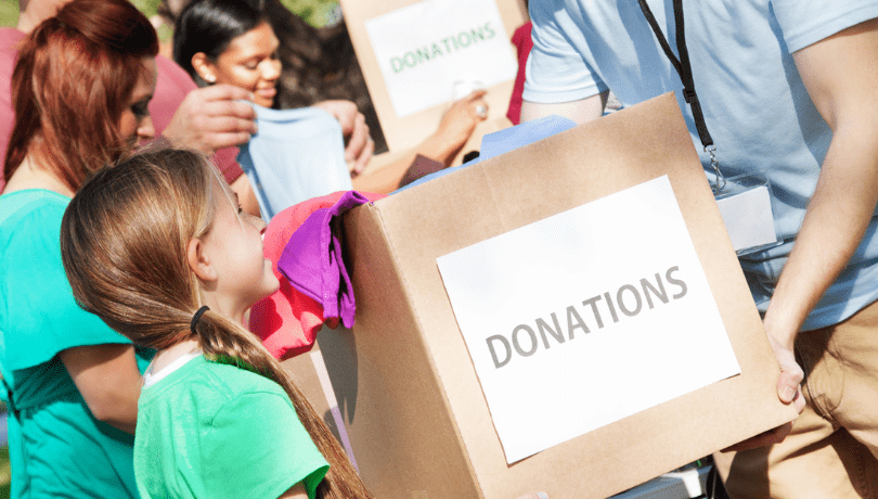 young-girl-donating-in-a-community-drive