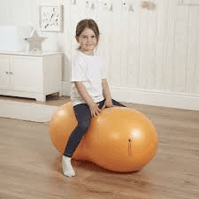 Child Sitting on Therapy Ball